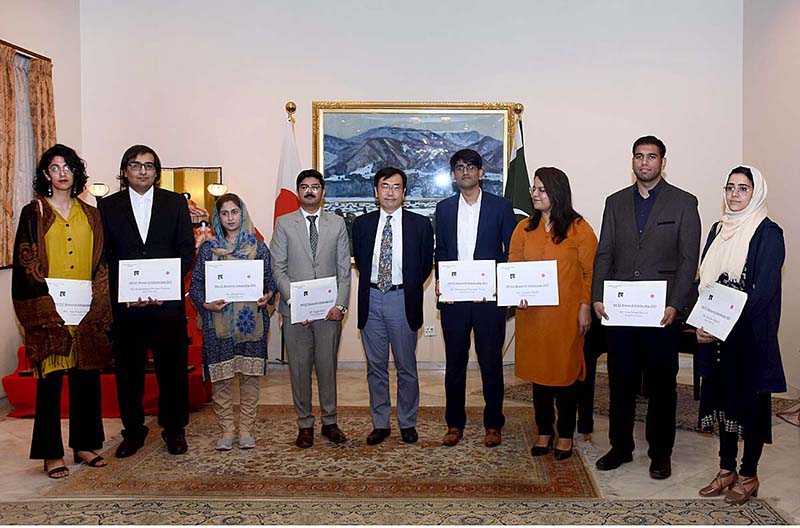 ITO Takeshi, Chargé d' Affaires, Embassy of Japan, in a group photo with the Pakistani students awarded Japan’s MEXT Research scholarships to pursue higher studies in Japan at a send-off reception held at the Embassy of Japan