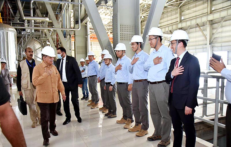 Prime Minister Muhammad Shehbaz Sharif interacts with the engineers working at the 330MW Thai Nova Electric Power Plant Site