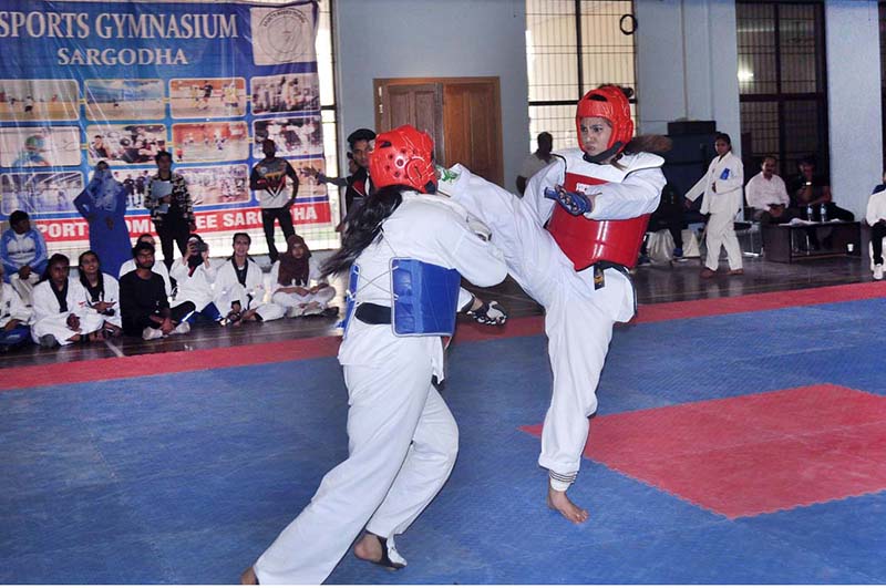 Players are in action at All Pakistan Universities Taekwondo Championship during Higher Education Commission Sports Gala organised by University of Sargodha at Sports Gymnasium