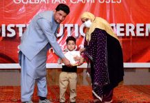 Director TKS Asif Sarwar and Principal TKS Junior Campus Arooj Afroz giving shield and certificate to position holder student during 7th Annual Prize Distribution Ceremony of TKS