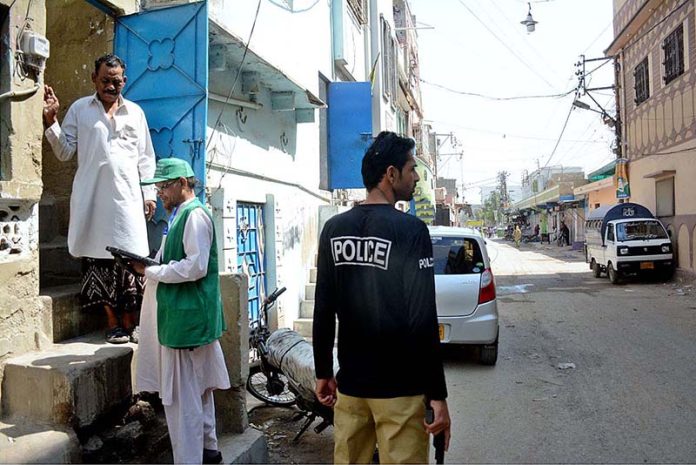 Officials from the Pakistan Bureau of Statistics collect information from a resident at the second phase of the digital census