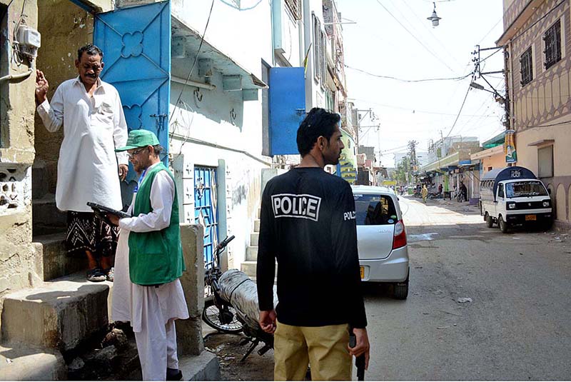 Officials from the Pakistan Bureau of Statistics collect information from a resident at the second phase of the digital census