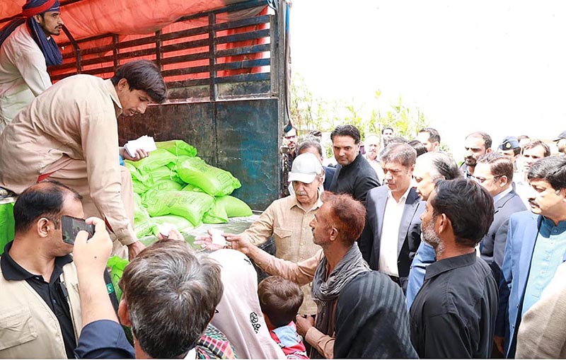 Prime Minister Muhammad Shehbaz Sharif distributes free Atta (Flour) among the beneficiaries of Free Atta Scheme