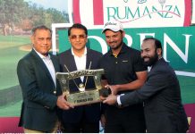 President Golf and country club rumanza giving trophy to the winner of first rumanza open golfing skills and nail- biting competition at Rumanza