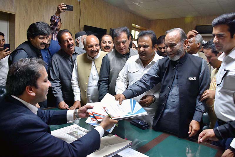 Senior PML-N leader Muhammad Mansha Ullah Butt is submitting his nomination papers to the Returning Officer for the candidate constituency PP-38
