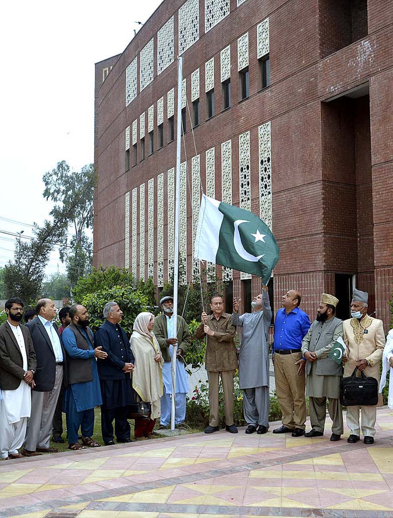 Chairman Nazria Pakistan Trust Foundation Mian Khalid Farooq hoisting national flag in connection with Pakistan Day at Nazria Pakistan Trust Foundation