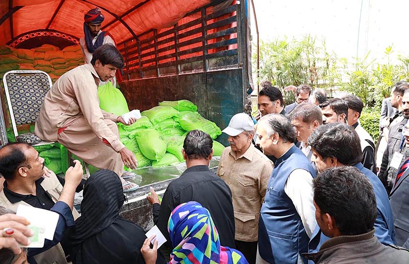 Prime Minister Muhammad Shehbaz Sharif distributes free Atta (Flour) among the beneficiaries of Free Atta Scheme