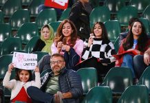 Spectators enjoying cricket match between Islamabad United and Karachi Kings teams during PSL 8 T20 cricket match at Rawalpindi Cricket Stadium
