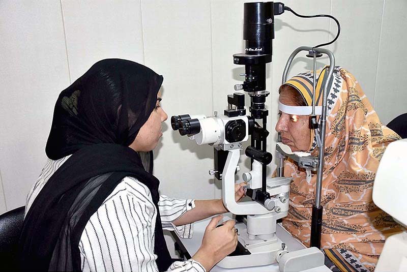 A lady doctor examines patients at the Free Eye Medical Camp