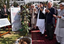 Chairman Senate, Muhammad Sadiq Sanjrani and parliamentarians offering Dua after planting a sapling Magnolia’s Tree at Parliament House Islamabad