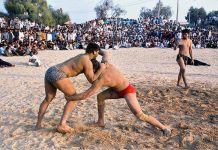 Wrestling match between Shahid Pahlwan and Ejaz Pahlwan during wrestling competition at the annual festival of Baba Zehar peer