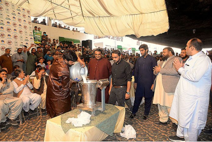 A view of Buffaloes Milking Contest during Spring Festival at Tent Pegging Ground