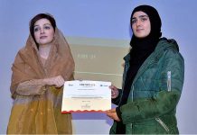 Chairperson Peace and Culture Organization and Wife of jailed Kashmiri Hurriyat leader Mohammad Yasin Malik, Mushaal Hussein Mullick giving certificate to a student during the event on “Struggle of Kashmiri Women Living under Indian Occupation” at SZABIST University
