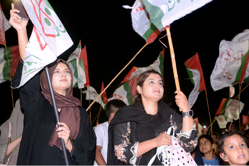 Women workers of Muttahida Qaumi Movement Pakistan chant slogans on the occasion of 39 Youm -e-Tasis at Bagh-e-Jinnah