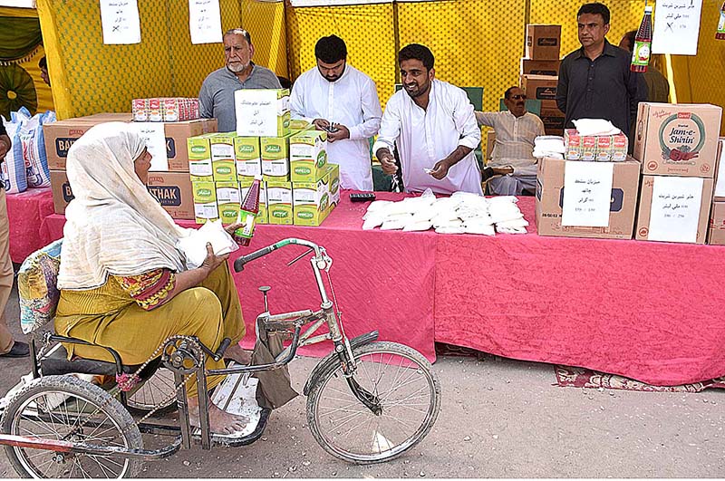 A special woman busy in purchasing food items from vendors at Ramzan Bachat Bazar during holy month of Ramzan set up by the District Government near Railway Station