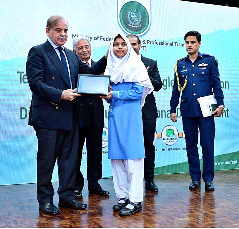 Prime Minister Muhammad Shehbaz Sharif distributes chrome books among the students as part of TeleSchool Pakistan and Google for Education programme