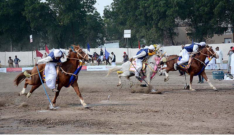 Players in action during last day of tent pegging championship organized by University of Agriculture Faisalabad (UAF) at its Sports Ground in connection with Spring Festival celebrations