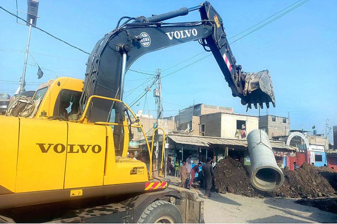 A heavy machinery being use for development work which underway at Karachi Neighborhood Improvement Project in District Malir Area