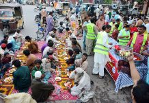 A view of people breaking their fast at Hyder Chowk organized by Sohni Dharti Youth Council during Holy month of Ramzan
