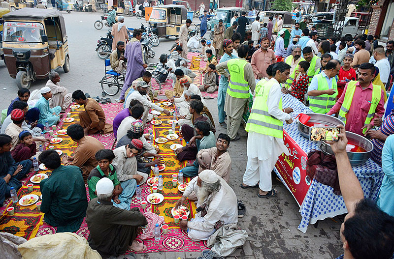 A view of people breaking their fast at Hyder Chowk organized by Sohni Dharti Youth Council during Holy month of Ramzan
