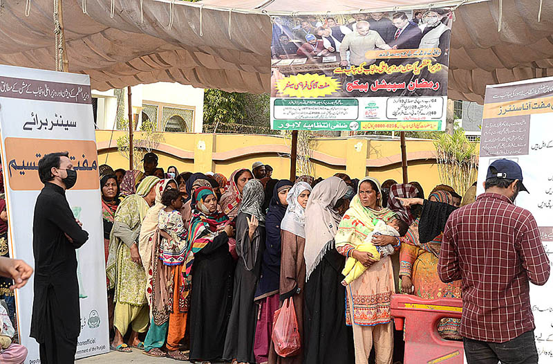 A large number of ladies standing in a queue to get free flour bags under Ramadan Package at Egerton Road