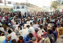 People are waiting to break their fast during holy month of Ramazan at Numaish Chowrangi