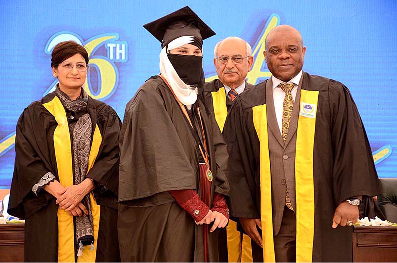 Ambassador Isiaka Abdulqadir Imam the D-8 Secretary General confers medals during 26th convocation of the University of Agriculture Faisalabad