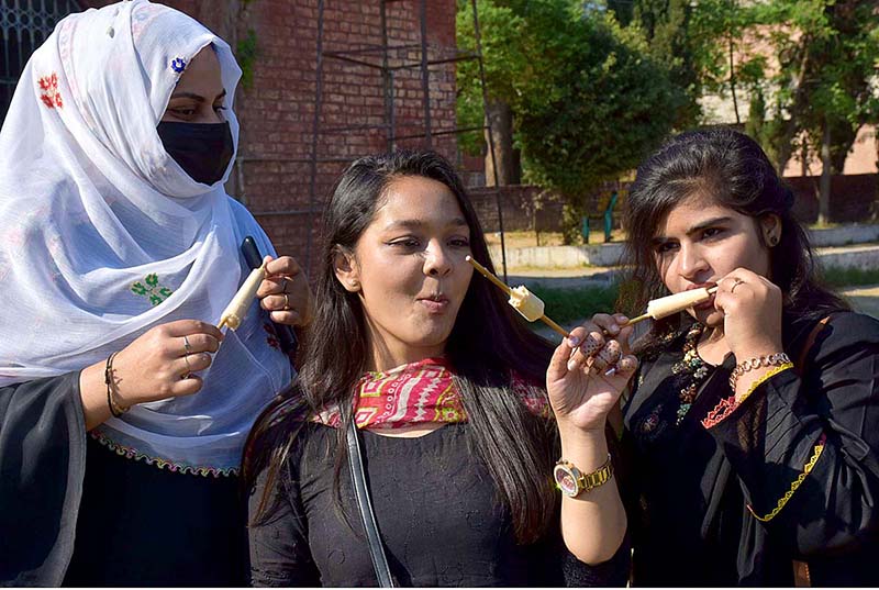 Student eating traditional ice cream “Kolfa” at the Cultural Day Event at Murray College