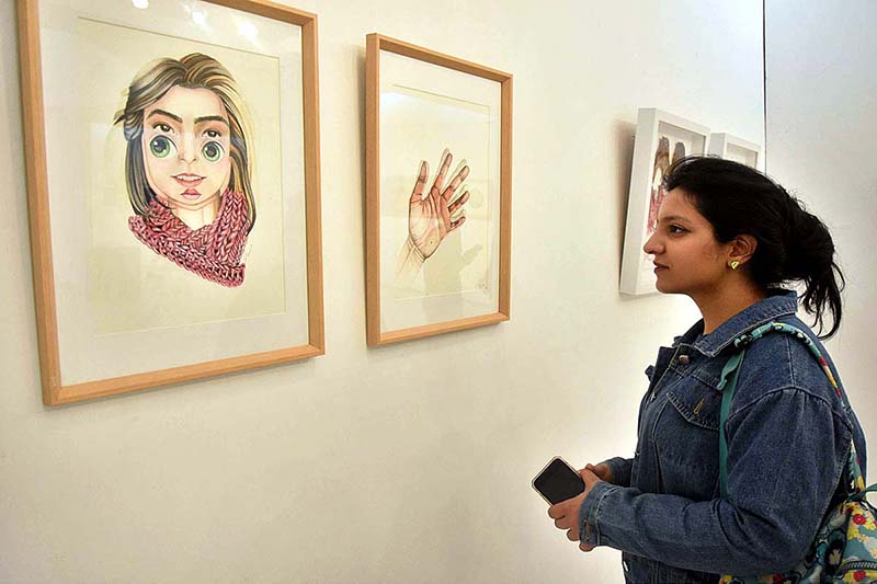 Visitor viewing the painting and different Arts work during Painting and Art Exhibition "Introspective Patterns of Interpersonal Relations" at Alhamra