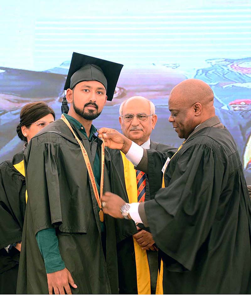 Ambassador Isiaka Abdulqadir Imam the D-8 Secretary General confers medals during 26th convocation of the University of Agriculture Faisalabad