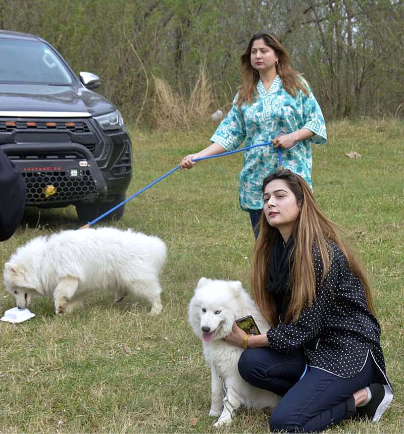 Women along with their Dogs during the International All-breed Championship Dog Show organized by Canine Union Pakistan at F9 Park