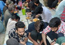 A view of people breaking their fast at iftar time during holy Ramadan near Shadman Chowk