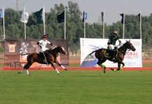 Players in action during final polo match at pink polo club DHA