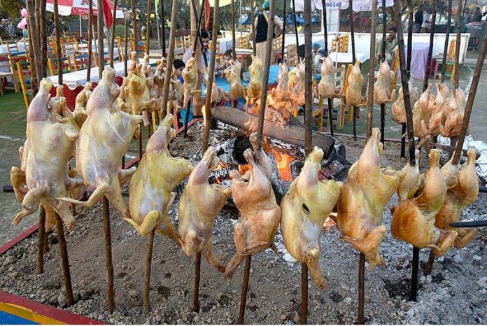 Vendor displaying the Traditional food to attract the customers during Jashan-e-Baharan Festival at Jillani Park organized by PHA