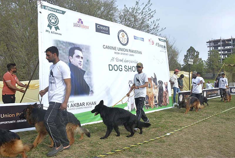 Handlers along with their Dogs during the International All-breed Championship Dog Show organized by Canine Union Pakistan at F9 Park