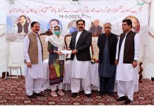 Federal Minister for Overseas Pakistani and Human Resources Development Sajid Hussain Turi distributes checks among labours for Death Grant and Marriage Grant under Welfare Board in Balochistan