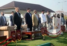 President Dr Arif Alvi and others stand as national anthem of Pakistan plays During final polo match at pink polo club DHA