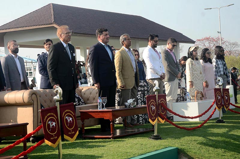 President Dr Arif Alvi and others stand as national anthem of Pakistan plays During final polo match at pink polo club DHA