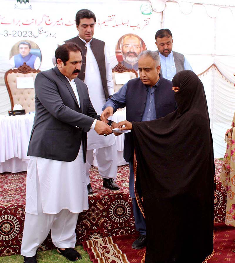 Federal Minister for Overseas Pakistani and Human Resources Development Sajid Hussain Turi distributes checks among labours for Death Grant and Marriage Grant under Welfare Board in Balochistan