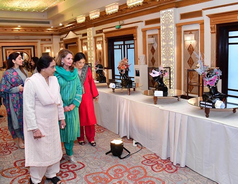 First Lady Begum Samina Alvi viewing the floral art pieces at the National Floral Art Show held by the Floral Art Society of Pakistan's Islamabad Chapter