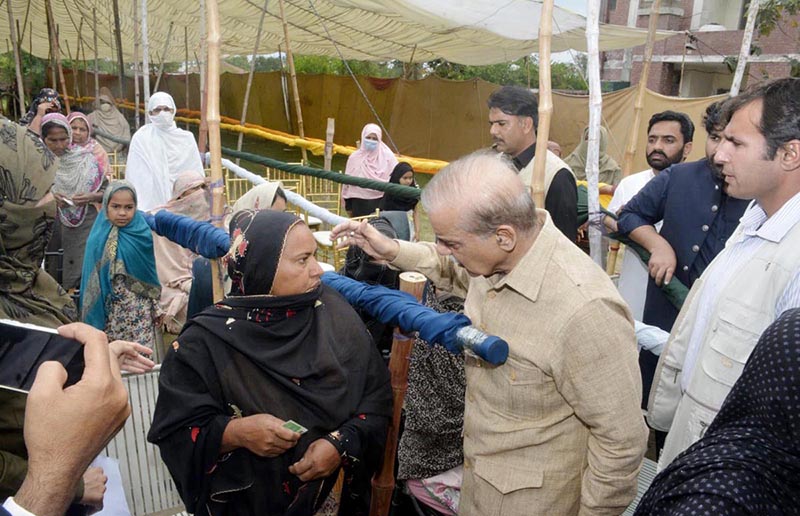 Prime Minister Muhammad Shehbaz Sharif interacts with the beneficiaries of Free Atta Scheme