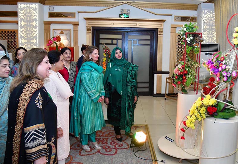 First Lady Begum Samina Alvi viewing the floral art pieces at the National Floral Art Show held by the Floral Art Society of Pakistan's Islamabad Chapter