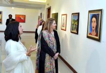 First Lady Begum Samina Arif Alvi viewing the art works on display at the solo painting exhibition of the Former Ambassador, Naela Chohan, at Pakistan National Council of Arts. The art works are aimed at creating awareness about Breast Cancer, Mental Health issues, Gender Equality and the Suffering of the Women of the Indian Illegally Occupied Jammu and Kashmir