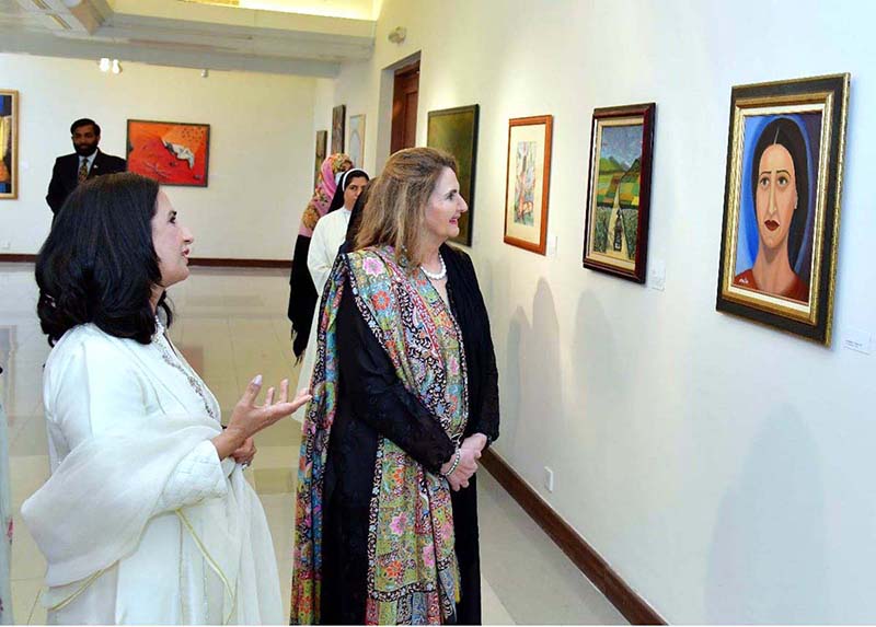 First Lady Begum Samina Arif Alvi viewing the art works on display at the solo painting exhibition of the Former Ambassador, Naela Chohan, at Pakistan National Council of Arts. The art works are aimed at creating awareness about Breast Cancer, Mental Health issues, Gender Equality and the Suffering of the Women of the Indian Illegally Occupied Jammu and Kashmir