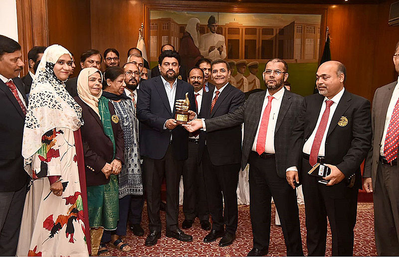 Administrator Karachi Dr. Saifur Rehman presenting the commemorative shield of Karachi Games to Governor Sindh Kamran Khan Tesori in a ceremony organized at Governor House