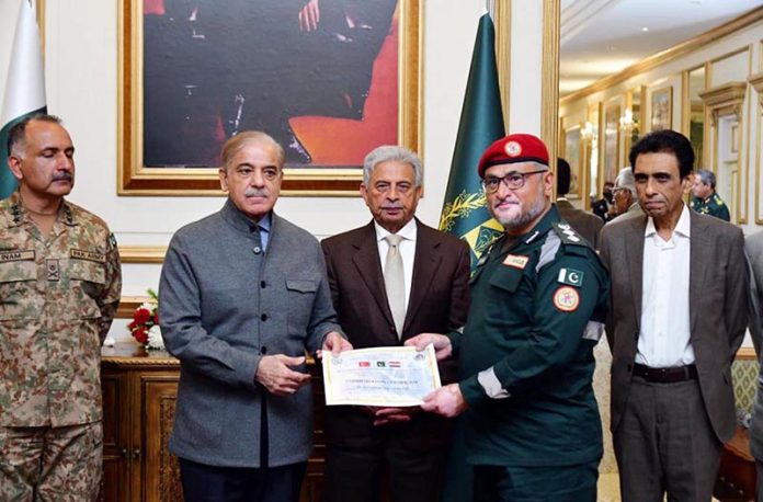 Prime Minister Muhammad Shehbaz Sharif distributing certificates of appreciation among the members of Pakistan's Search and Rescue teams who rendered services in the earthquake affected areas of Turkiye and Syria