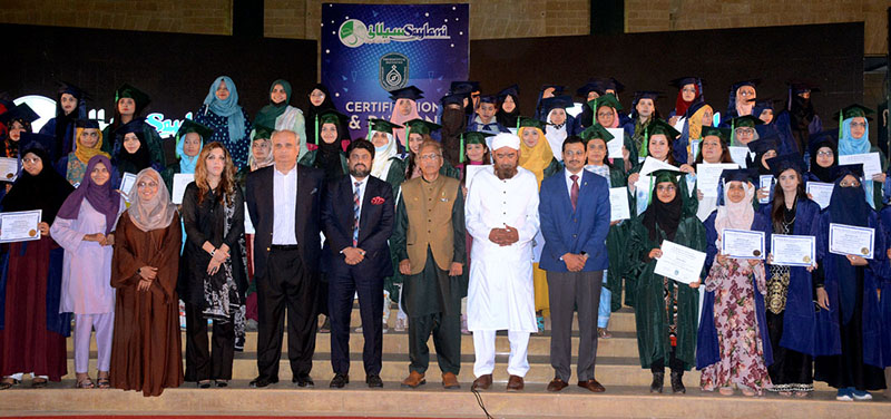 President Dr. Arif Alvi in a group photograph during the certificate distribution ceremony of SMIT and PIAIC student organized by Saylani Welfare Trust