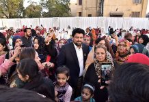Women taking photo with Governor Sindh Kamran Khan Tesori during Dawat-e-Iftar at the Governor House