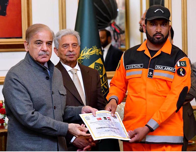 Prime Minister Muhammad Shehbaz Sharif distributing certificates of appreciation among the members of Pakistan's search and rescue teams who rendered services in the earthquake affected areas of Turkiye and Syria