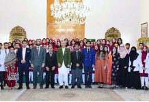 President Dr. Arif Alvi in a group photo with the medical students of Azad Jammu Kashmir Medical College, Muzaffarabad (AJKMC), who called on him, at Aiwan-e-Sadr